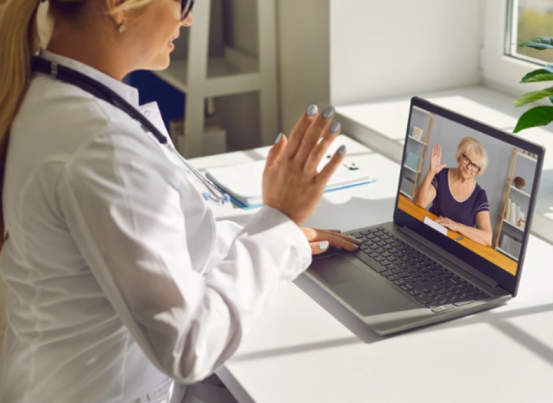 A doctor on a video chat with a patient.